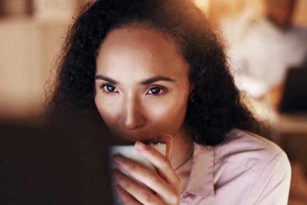 A woman looking at a screen